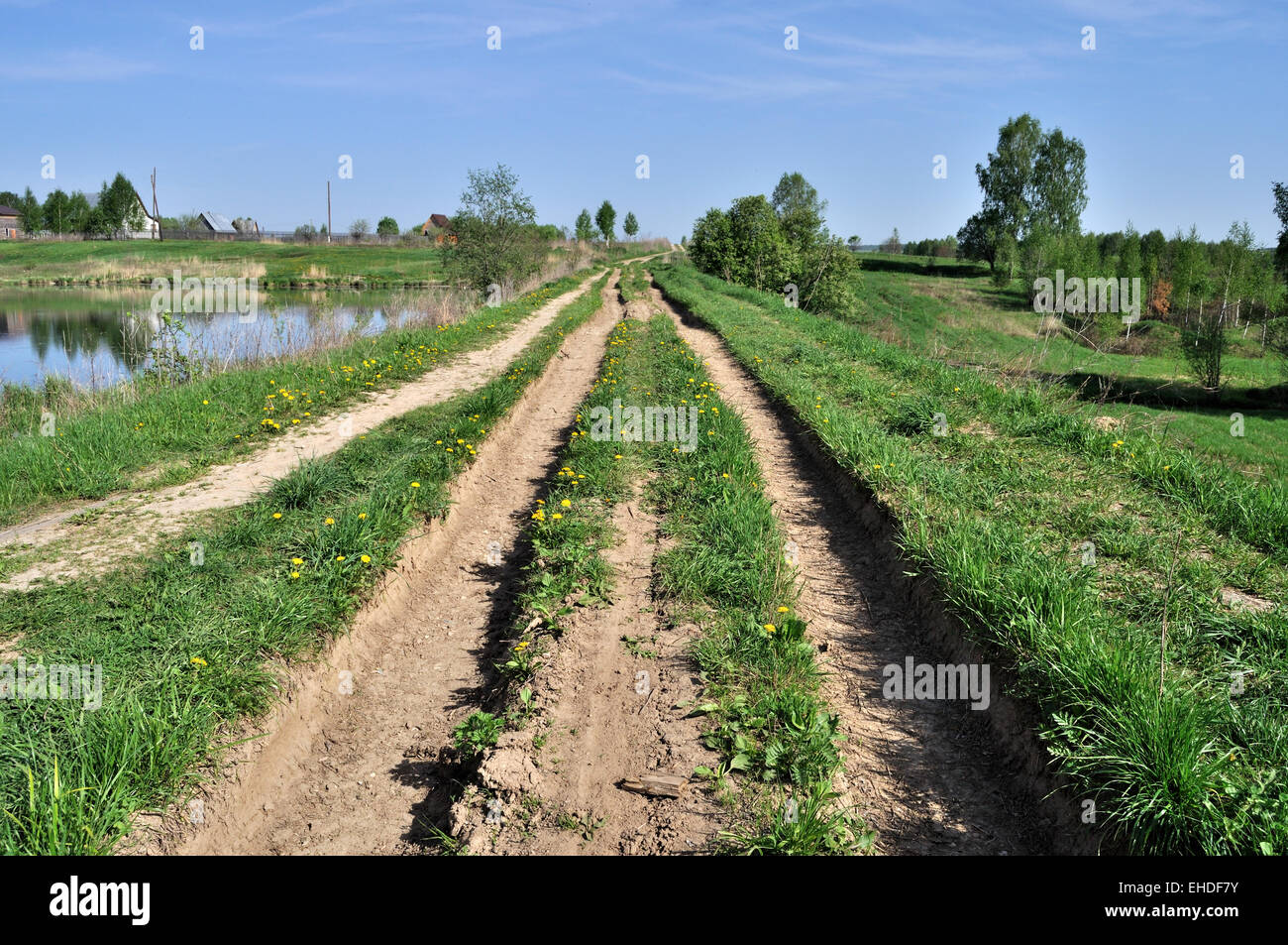 Landscape with earth rut in spring time Stock Photo - Alamy