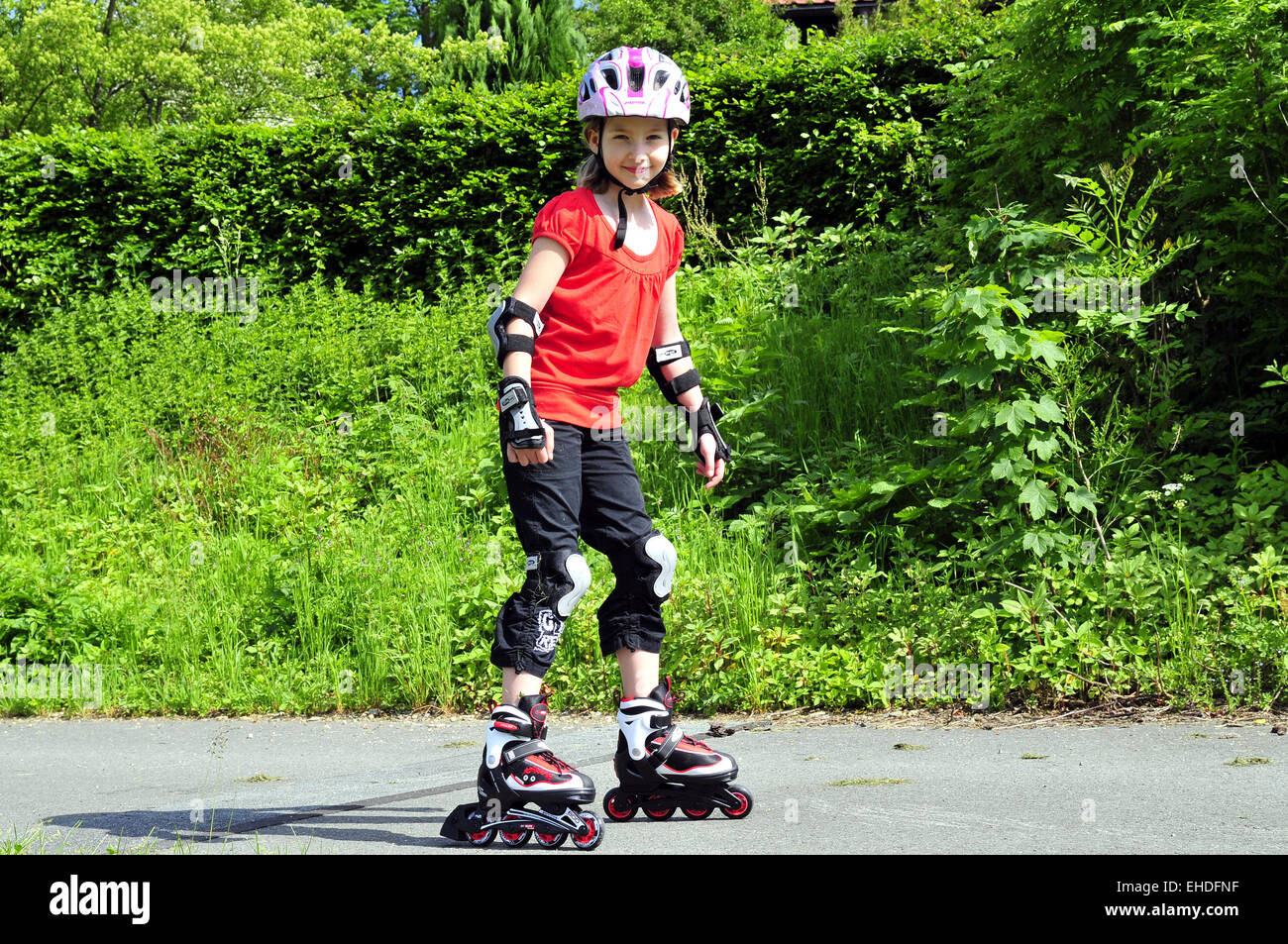 Inline skating child hires stock photography and images Alamy