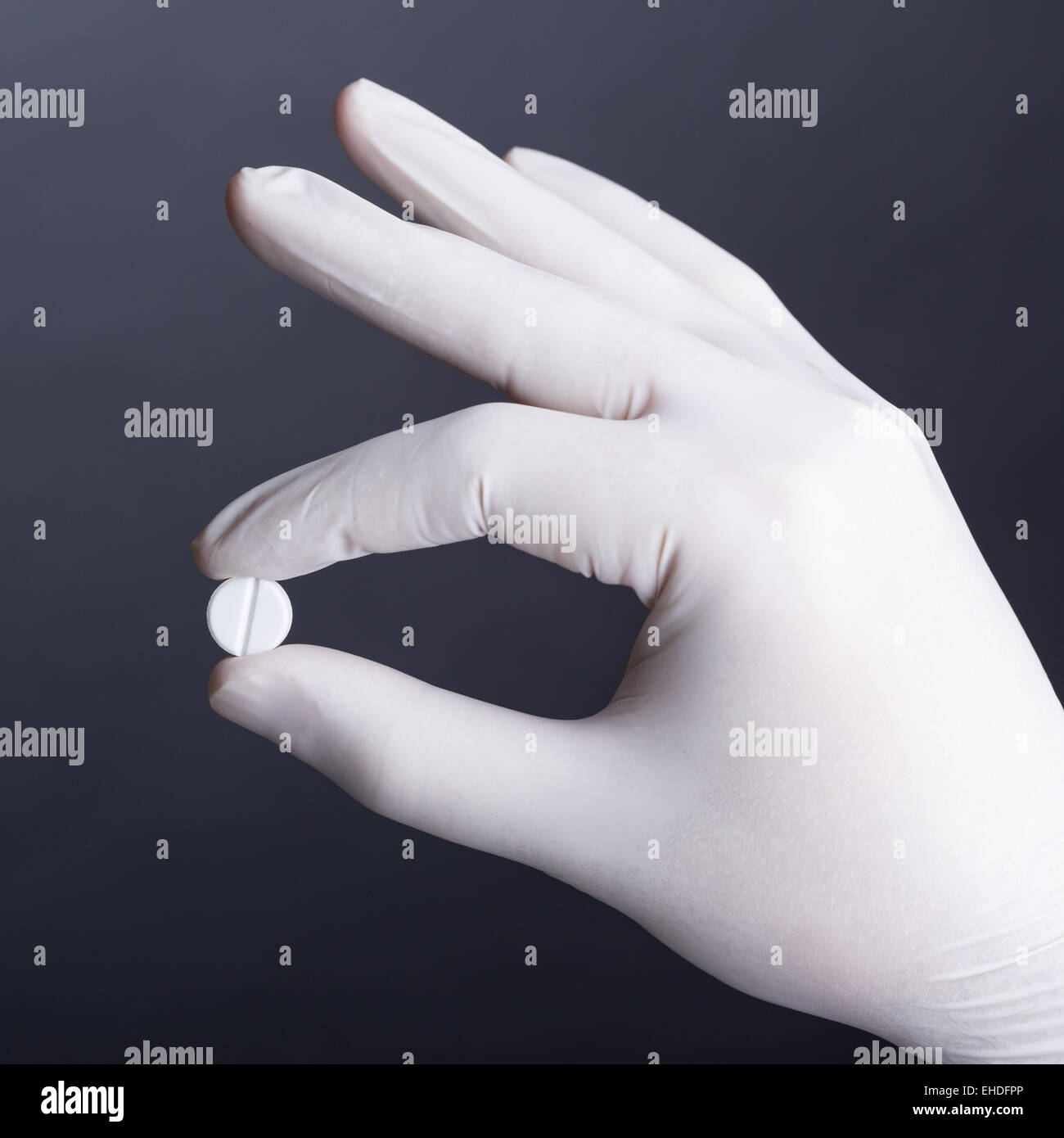 Hand with pill Stock Photo - Alamy