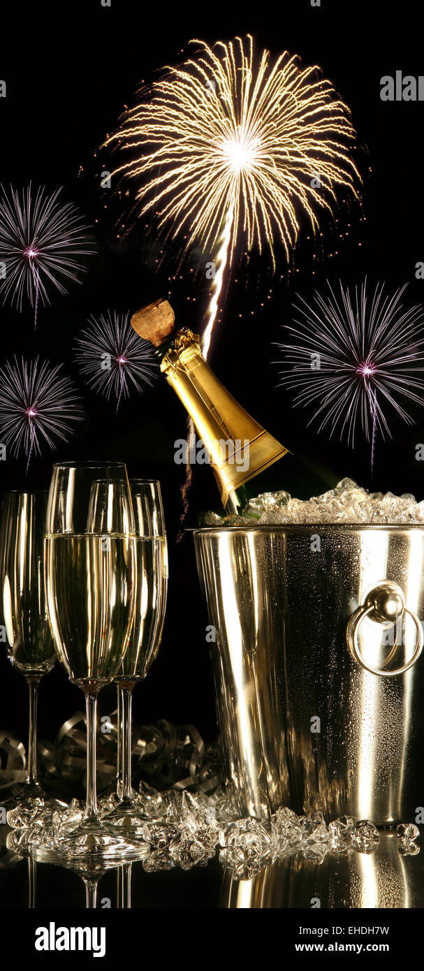 Glasses of champagne with fireworks Stock Photo - Alamy