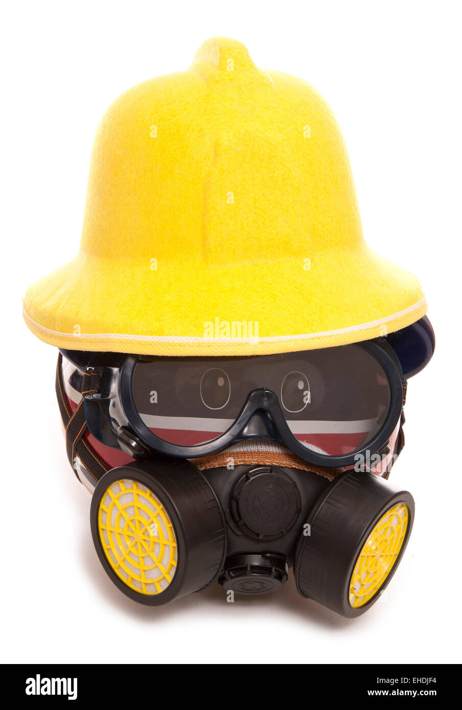 piggy bank wearing gas mask and fireman hat cutout Stock Photo