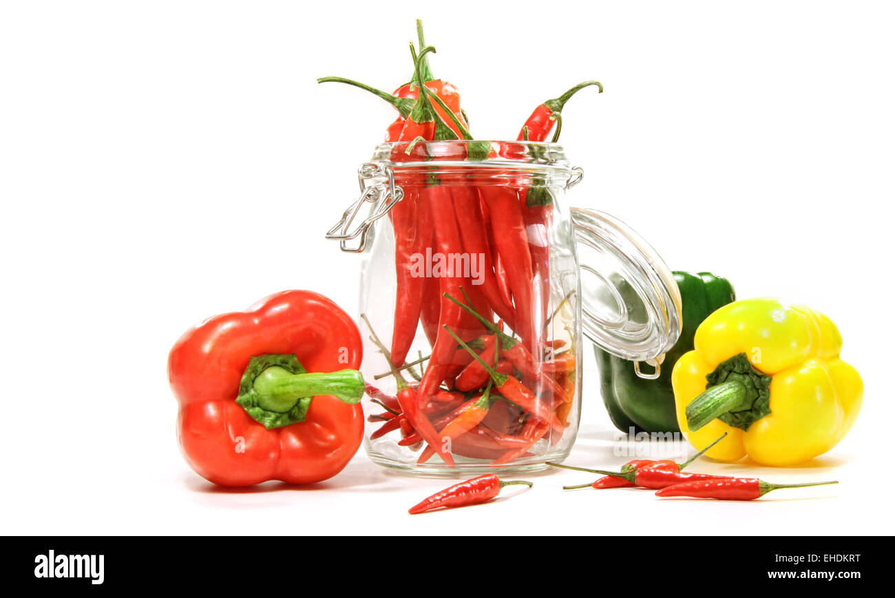Red peppers in glass jar isolated on white Stock Photo Alamy