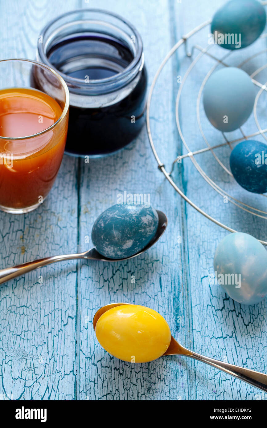 Easter eggs painted with natural dye: red cabbage and tumeric Stock Photo
