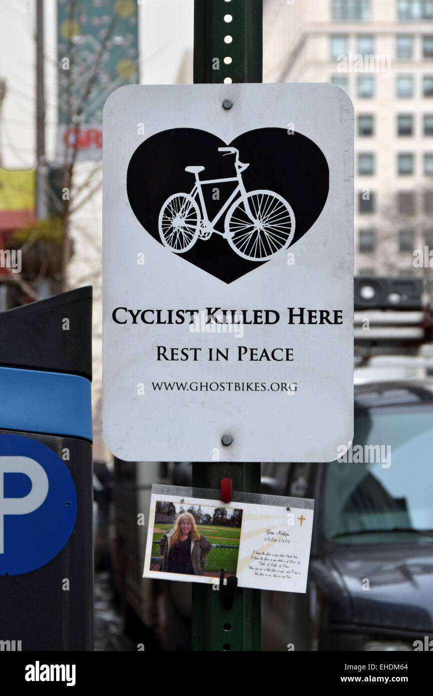 A sign on East 23rd Street in Manhattan paying tribute to a young woman who was killed cycling. New York City Stock Photo