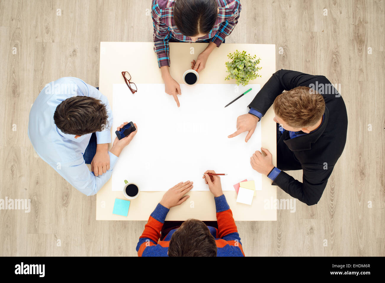 Top view table with group of working people Stock Photo - Alamy