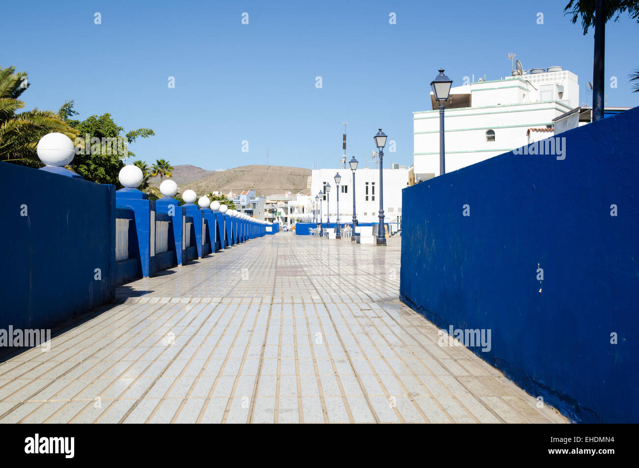 The walkway at Plaza las Maranuelas along the beach in the resort Arguineguin at the island Gran Canaria in Spain. Stock Photo