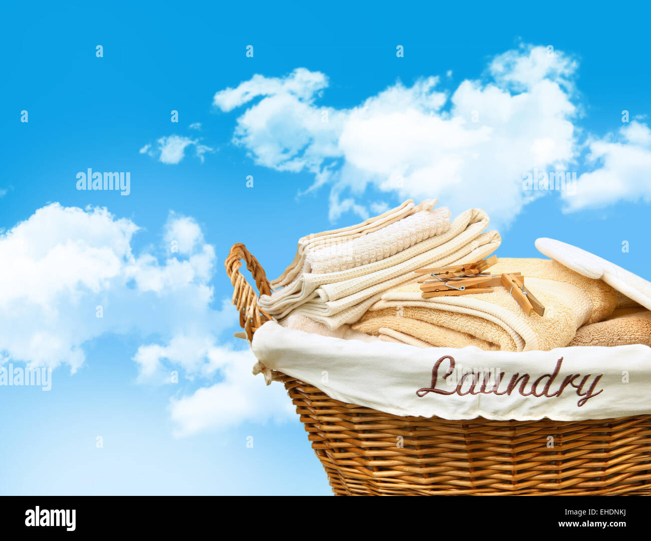 Laundry basket with towels Stock Photo Alamy