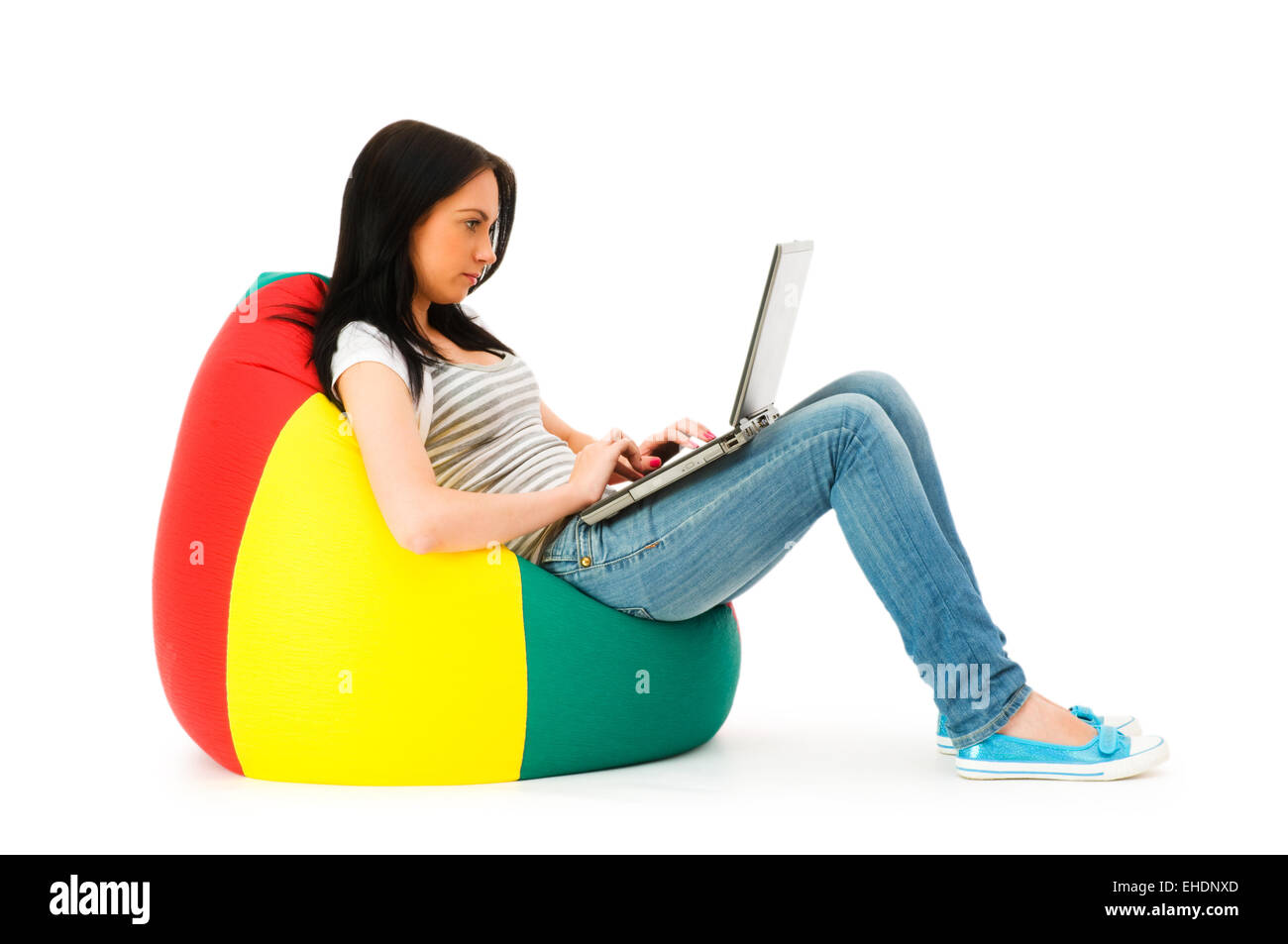 Girl working on laptop isolated on white Stock Photo - Alamy