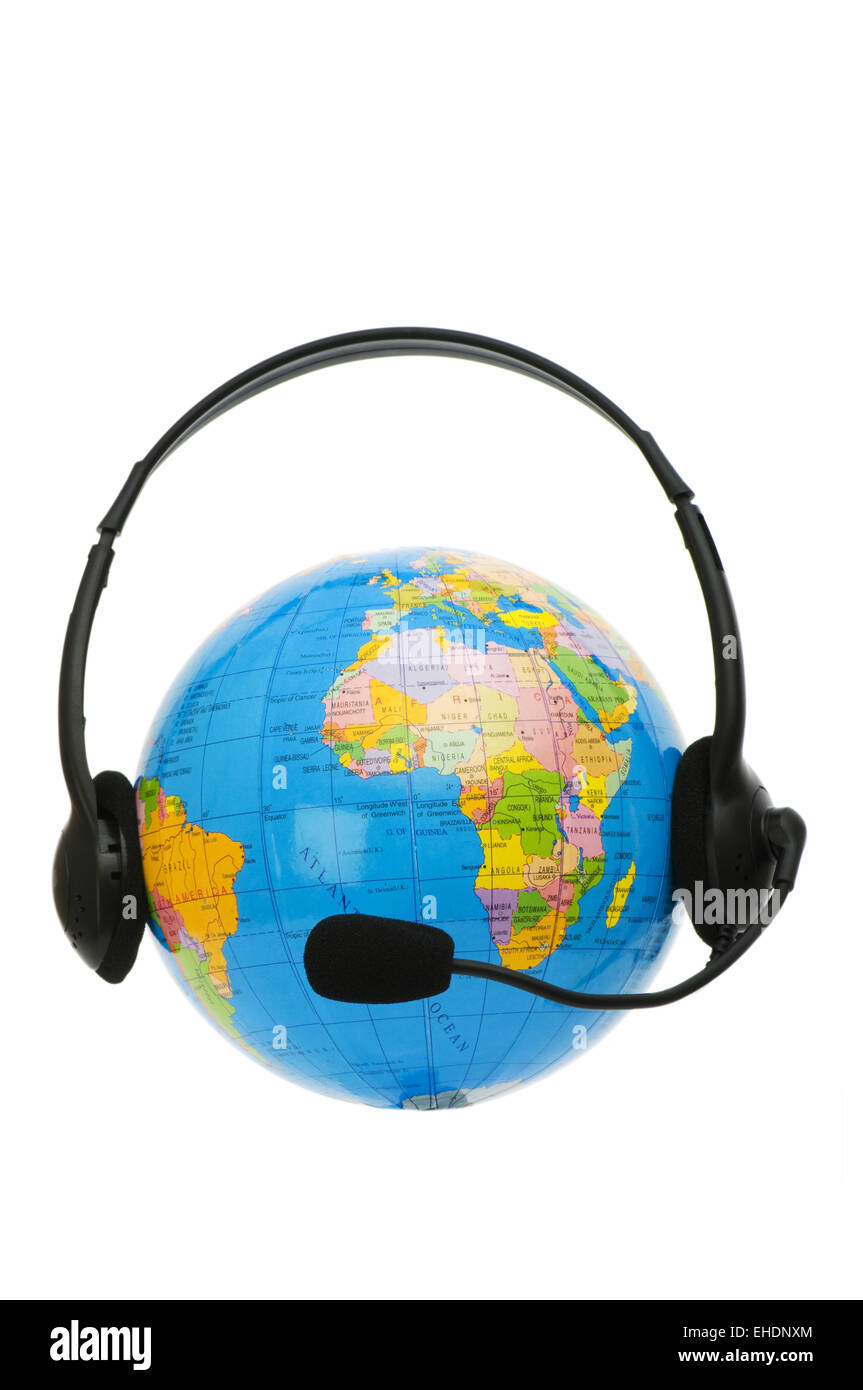 Headset on globe isolated on the white Stock Photo