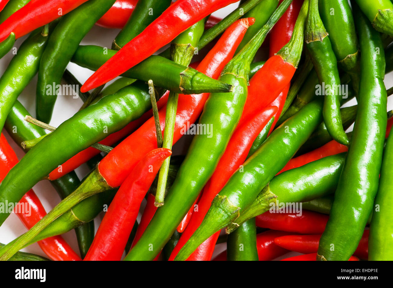 Red and green chili peppers Stock Photo - Alamy