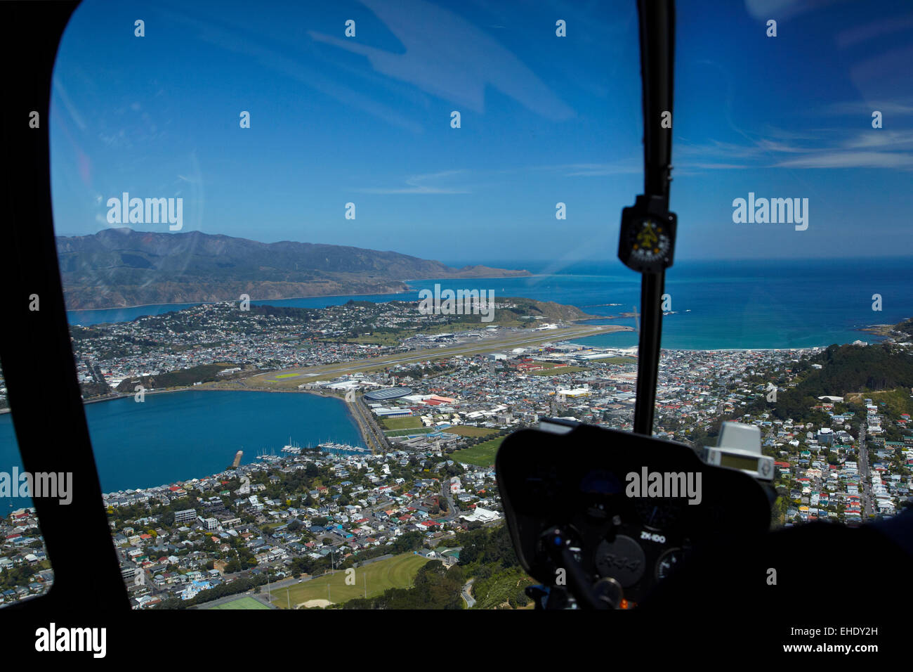 Wellington International Airport, Evans Bay and Lyall Bay,  viewed from Robinson R44 helicopter, Wellington, North Island, NZ Stock Photo
