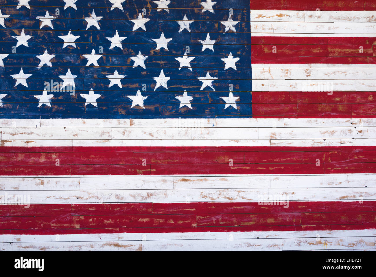 A painting of an American flag on a wood plank wall Stock Photo