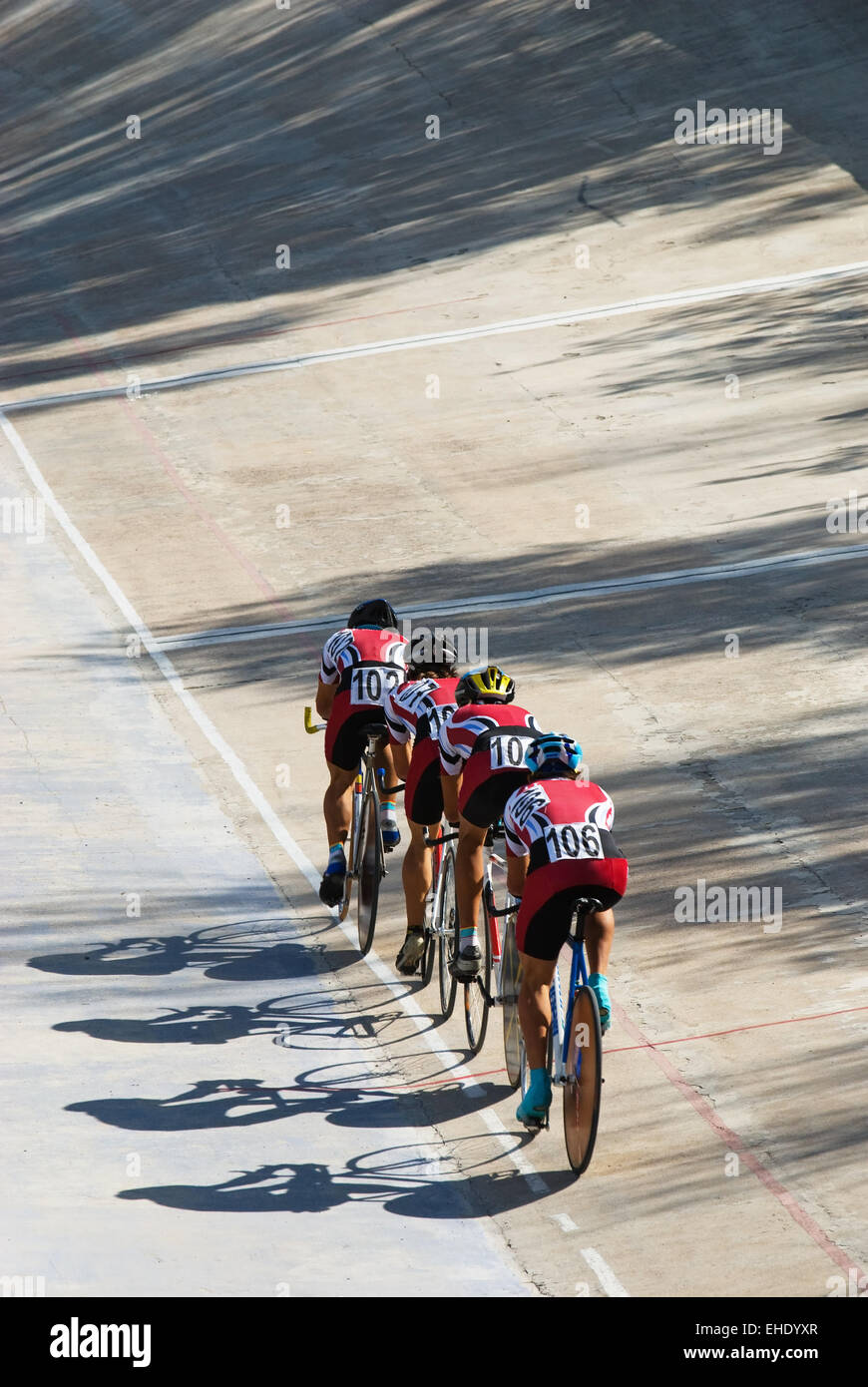 Cycling team racing on velodrome Stock Photo