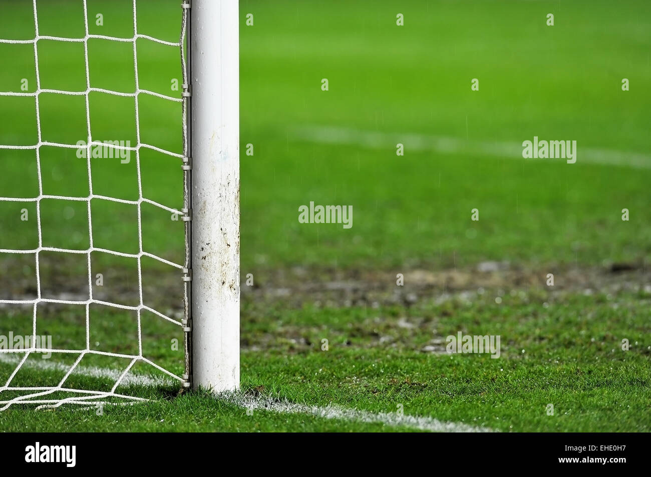 Sports shot with a soccer goal detail on rainy day Stock Photo
