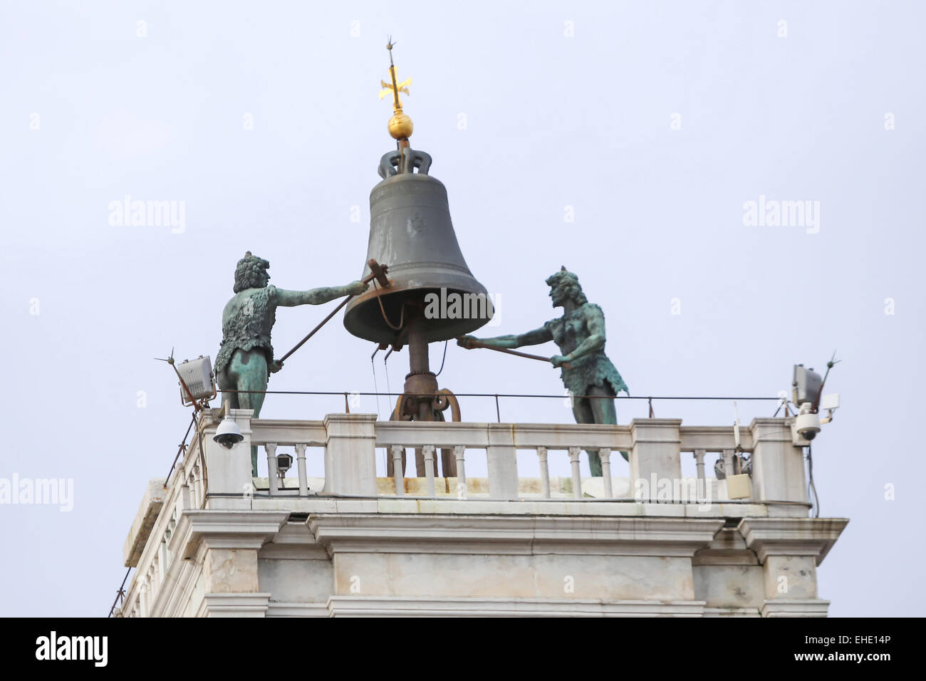 The bell and statues on the top of the Saint Mark Clocktower on the