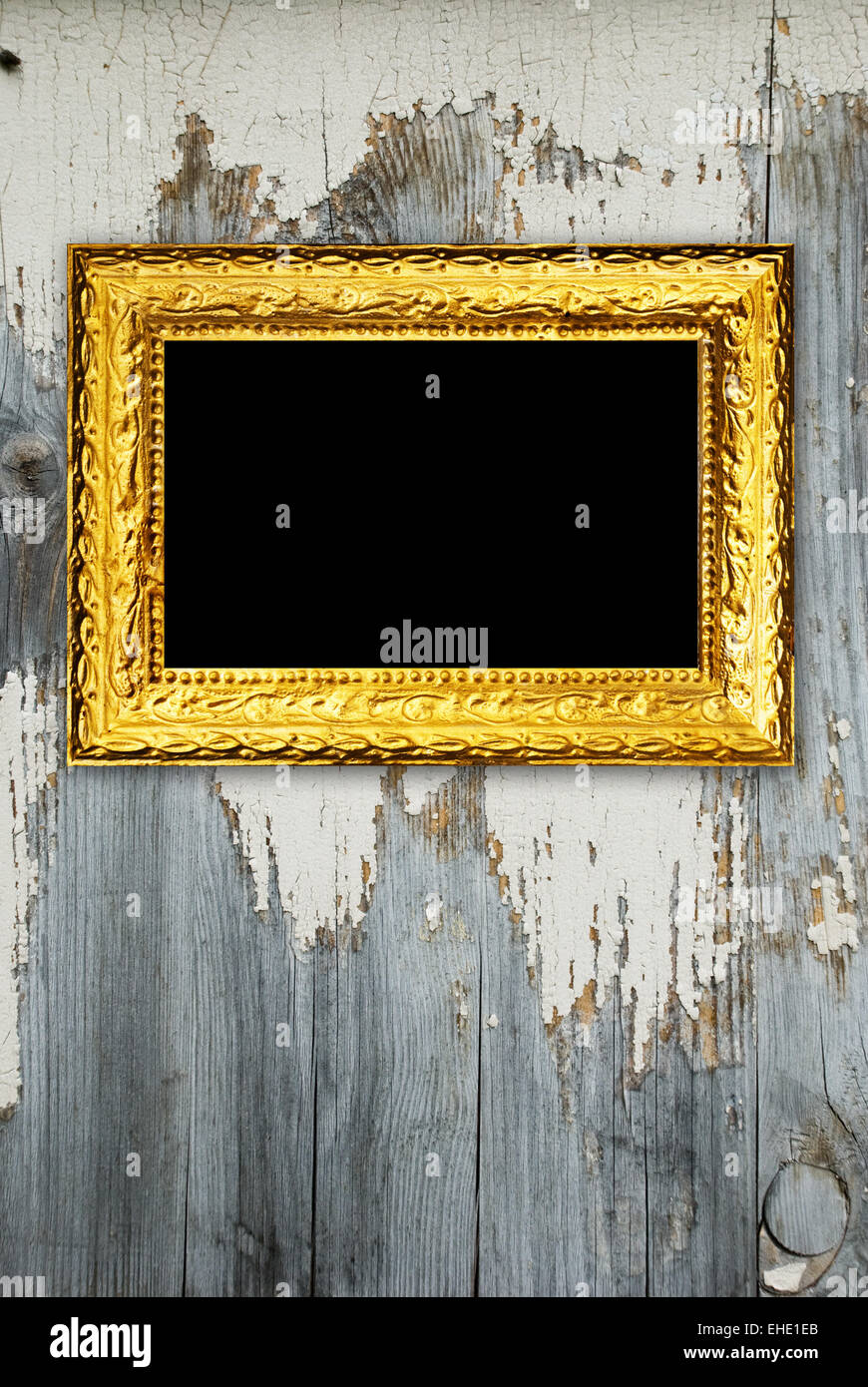 Gold frame on a old wooden wall background Stock Photo - Alamy