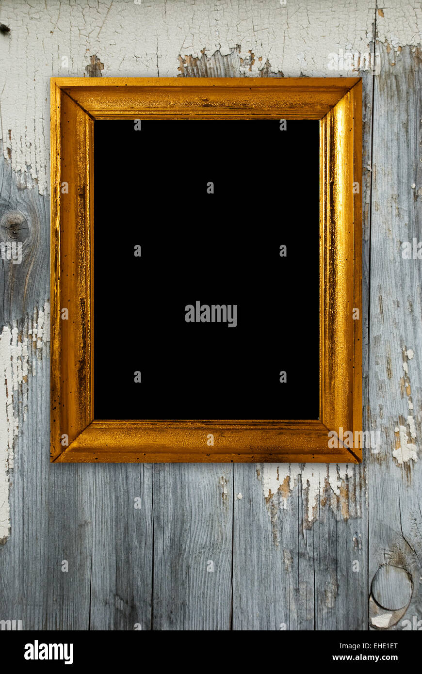 Gold frame on a old wooden wall background Stock Photo - Alamy