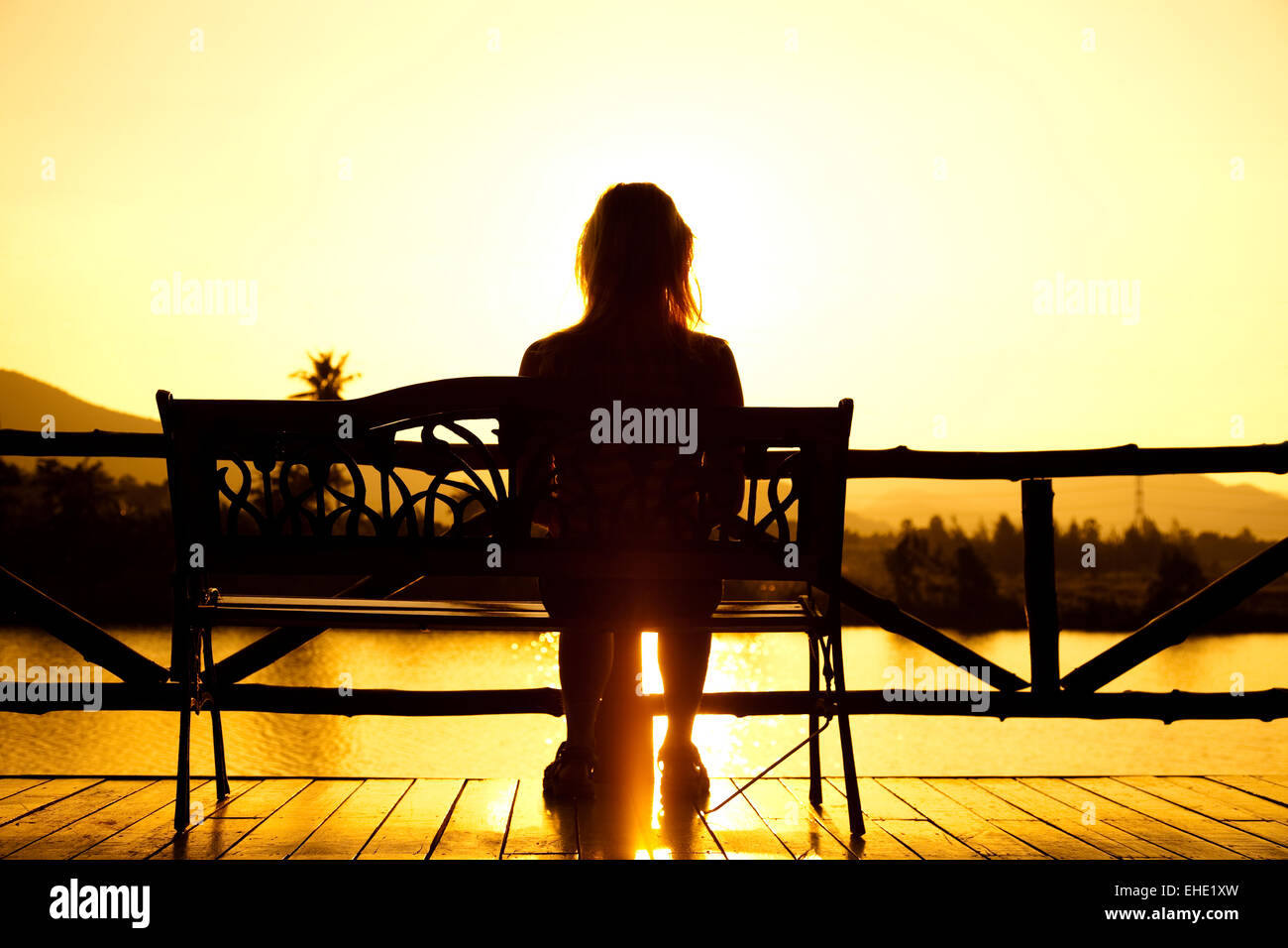 Girls sitting sea sunset hi-res stock photography and images - Alamy