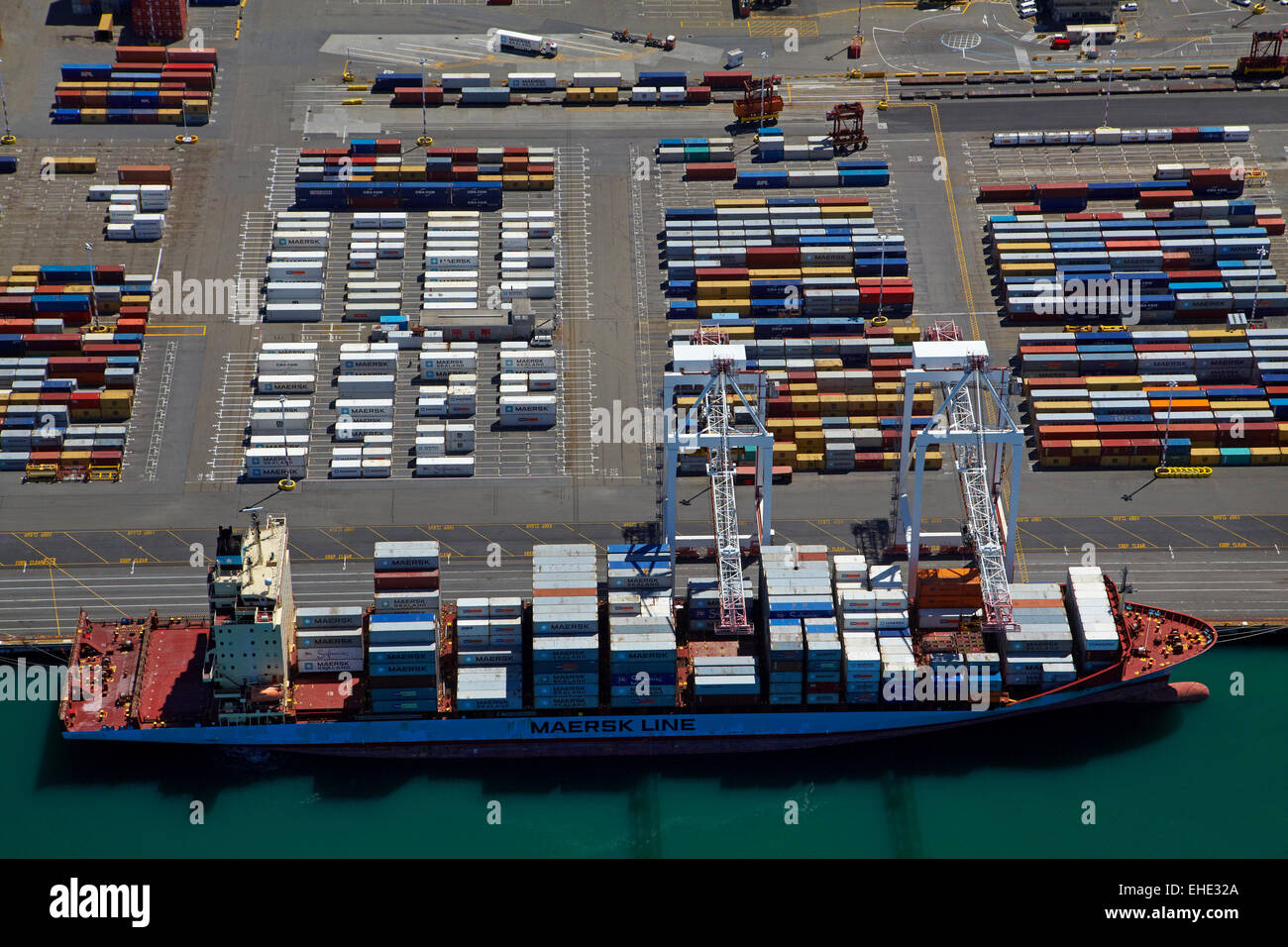 Container ship at Thorndon Container Terminal, Wellington, North Island, New Zealand - aerial Stock Photo