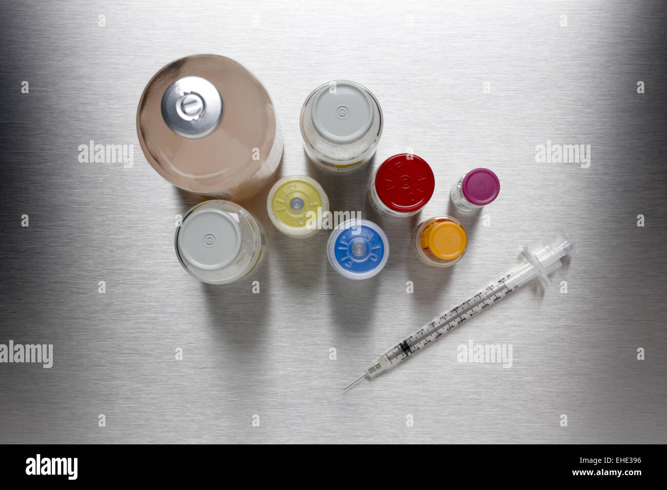 Syringe with drug bottles Stock Photo