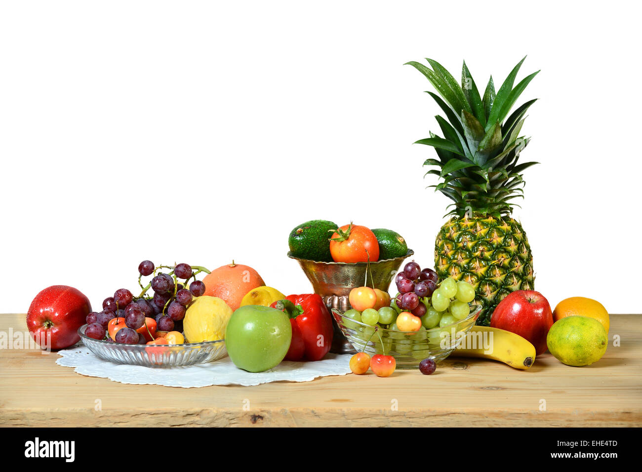 Assortment of fresh fruits and vegetables on wooden table indoors Stock ...