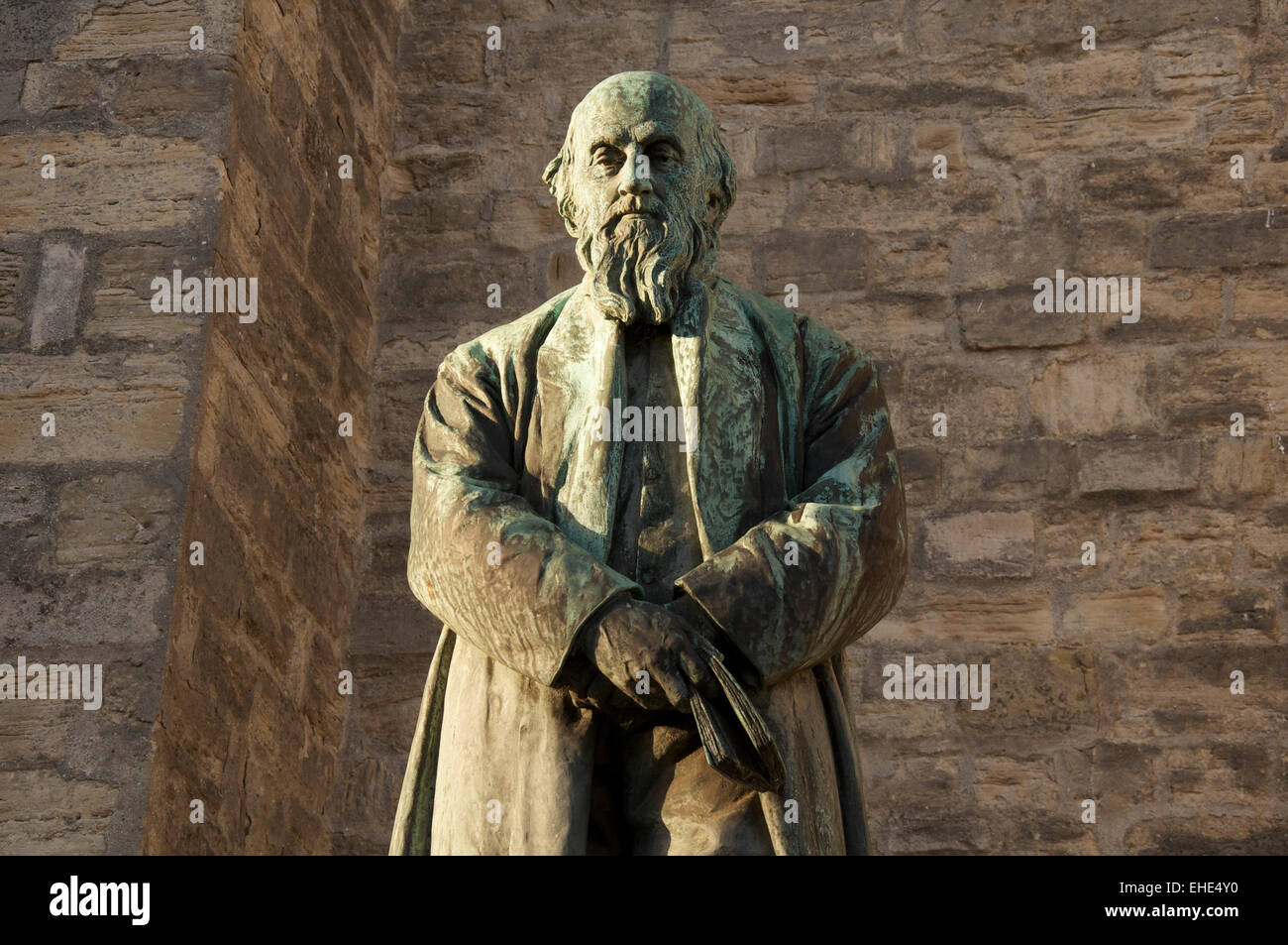 English literature. Evening sunshine falls on a statue of the poet William Barnes, known for his poetry in the Dorset dialect. Dorchester, England. UK Stock Photo