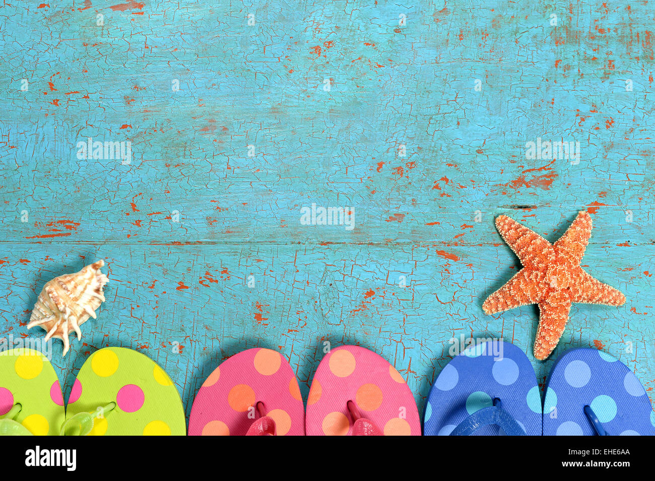Summer concept with flip flops of different colors, starfish and shell ...
