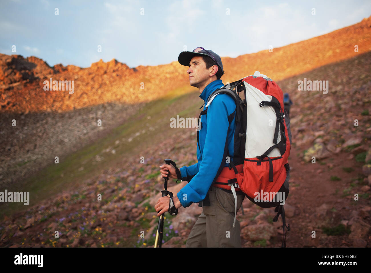 Backpacker in morning mountains Stock Photo - Alamy
