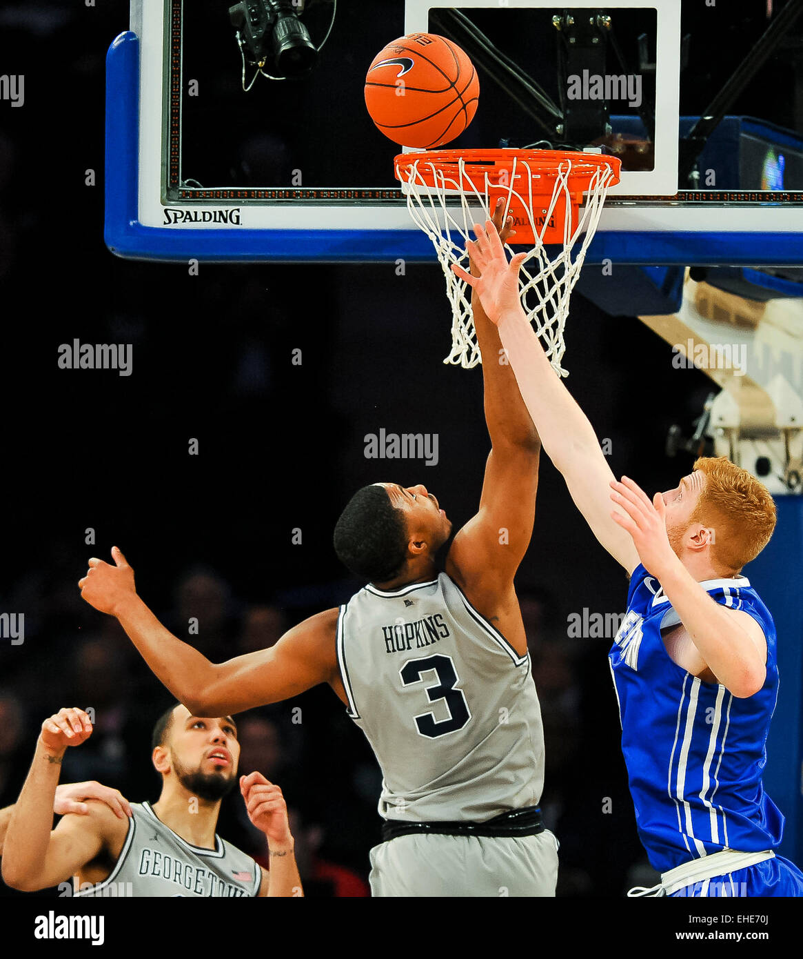 New York, NY, USA. 12th Mar, 2015. March 12, 2015: Georgetown senior forward Mikael Hopkins (3) and Creighton junior center Geoffrey Groselle (41) go up for a rebound during the matchup between the Creighton Bluejays and the Georgetown Hoyas in the Big East Tournament at Madison Square Garden in New York, New York. Scott Serio/CSM/Alamy Live News Stock Photo