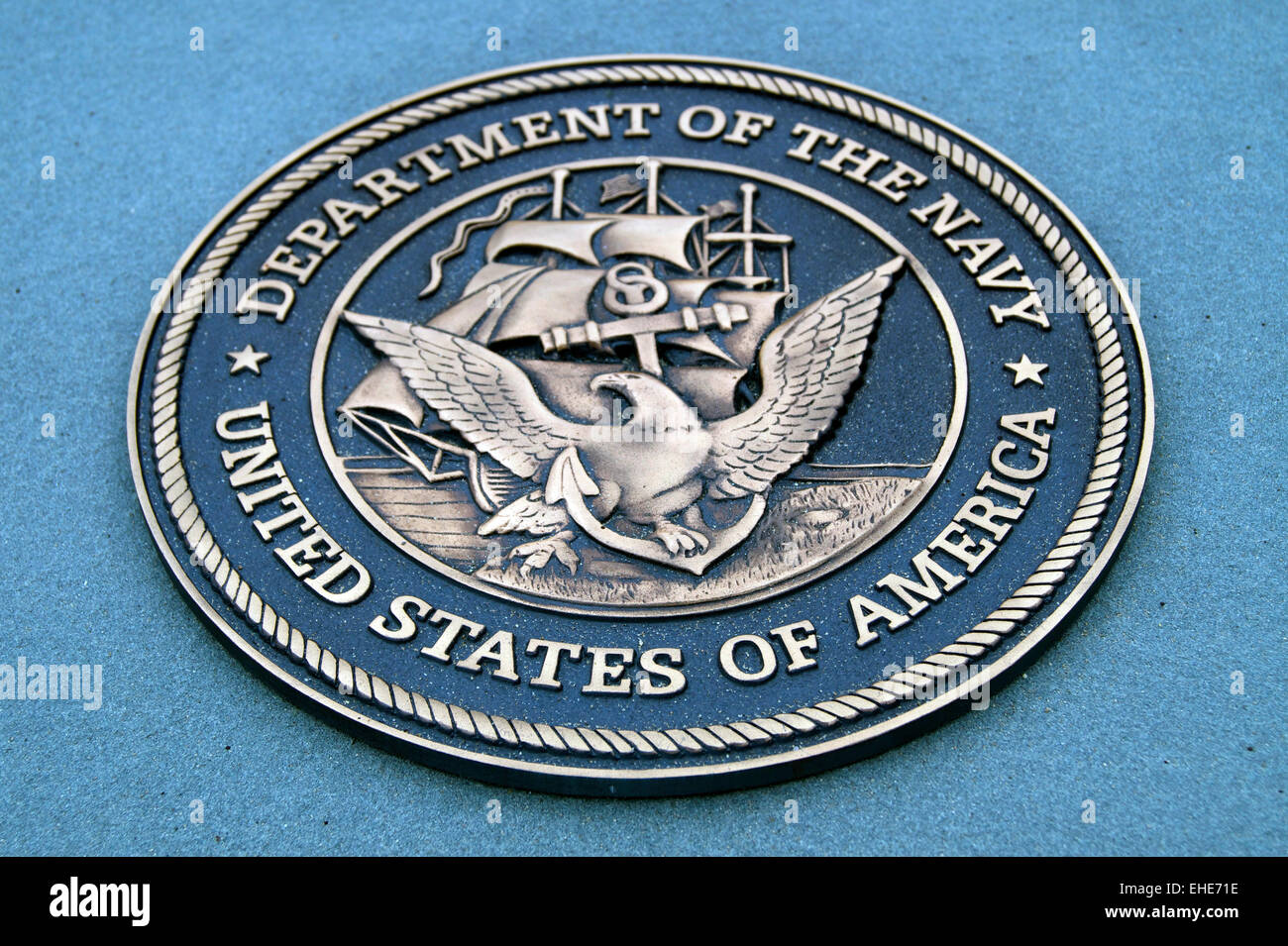 A brass relief of the Seal of the United States Navy Stock Photo