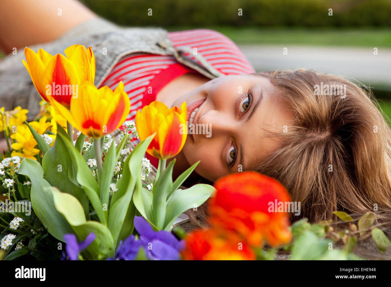 beautiful spring portrait with tulips Stock Photo - Alamy