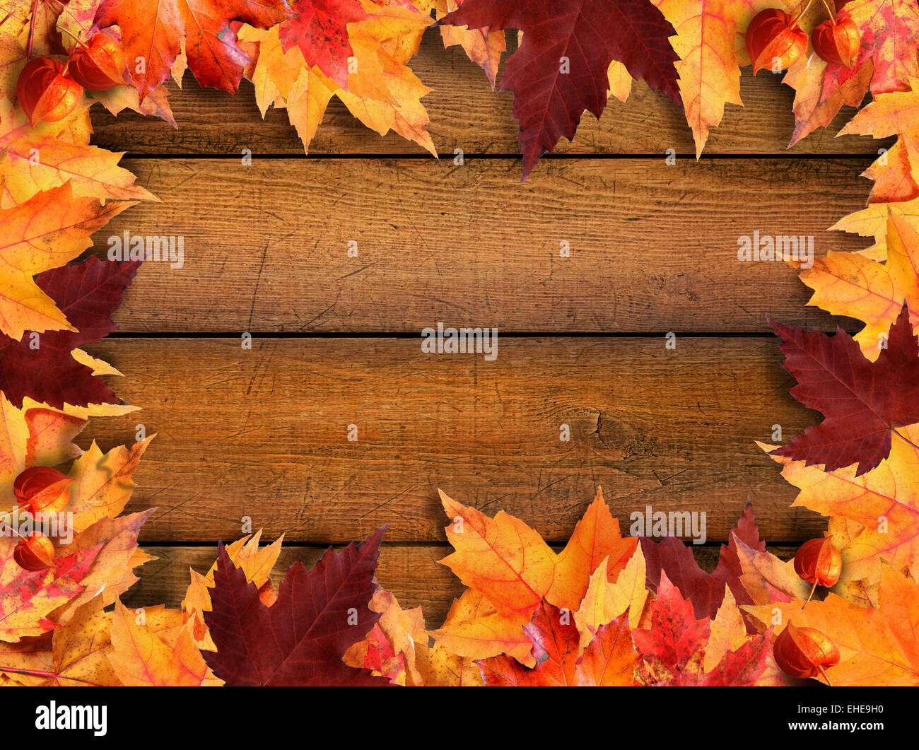 Autumn leaves frame on wood Stock Photo - Alamy