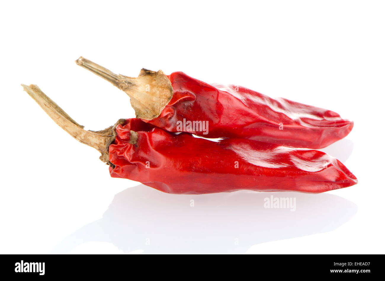 Red chili peppers on a white background Stock Photo - Alamy