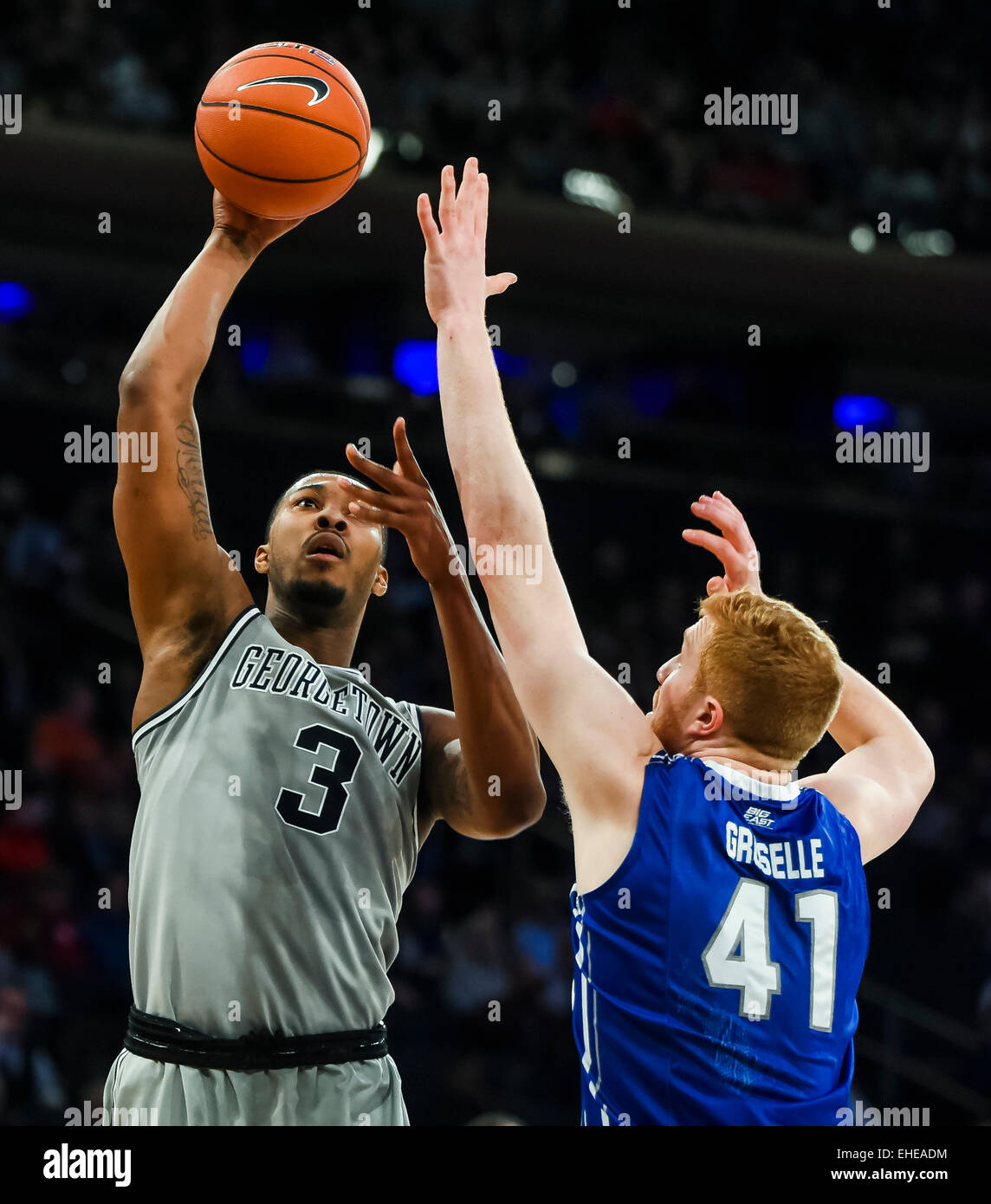 New York, NY, USA. 12th Mar, 2015. March 12, 2015: Georgetown senior forward Mikael Hopkins (3) jumps to take a shot against Creighton junior center Geoffrey Groselle (41) during the matchup between the Creighton Bluejays and the Georgetown Hoyas in the Big East Tournament at Madison Square Garden in New York, New York. Scott Serio/CSM/Alamy Live News Stock Photo