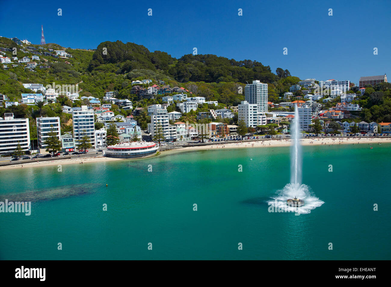 Fountain, Oriental Bay, and Mt Victoria, Wellington, North Island, New Zealand - aerial Stock Photo