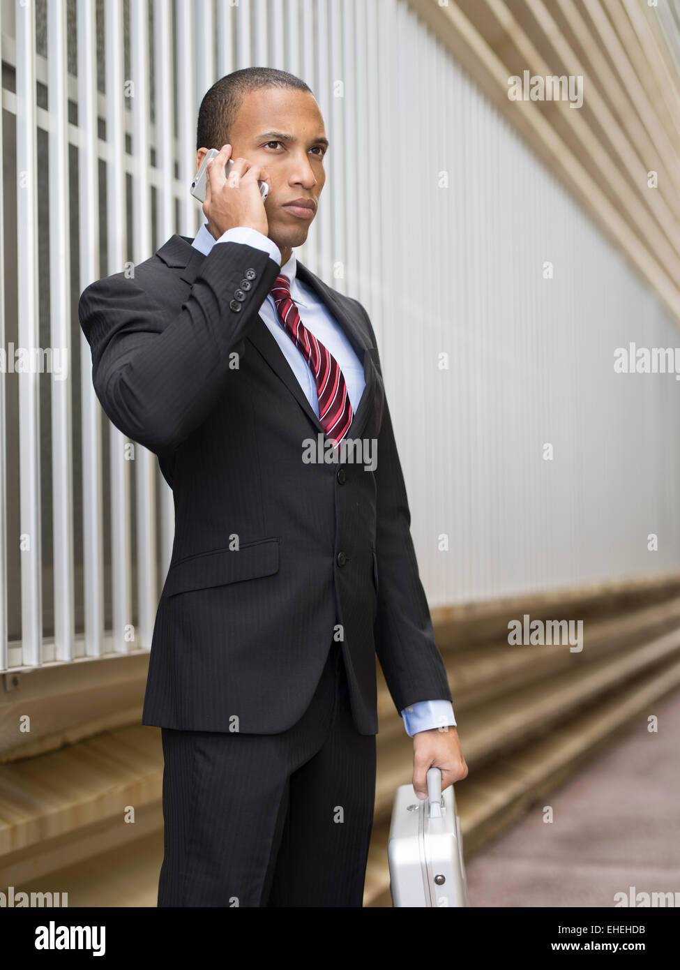 Businessman using Apple iphone Stock Photo