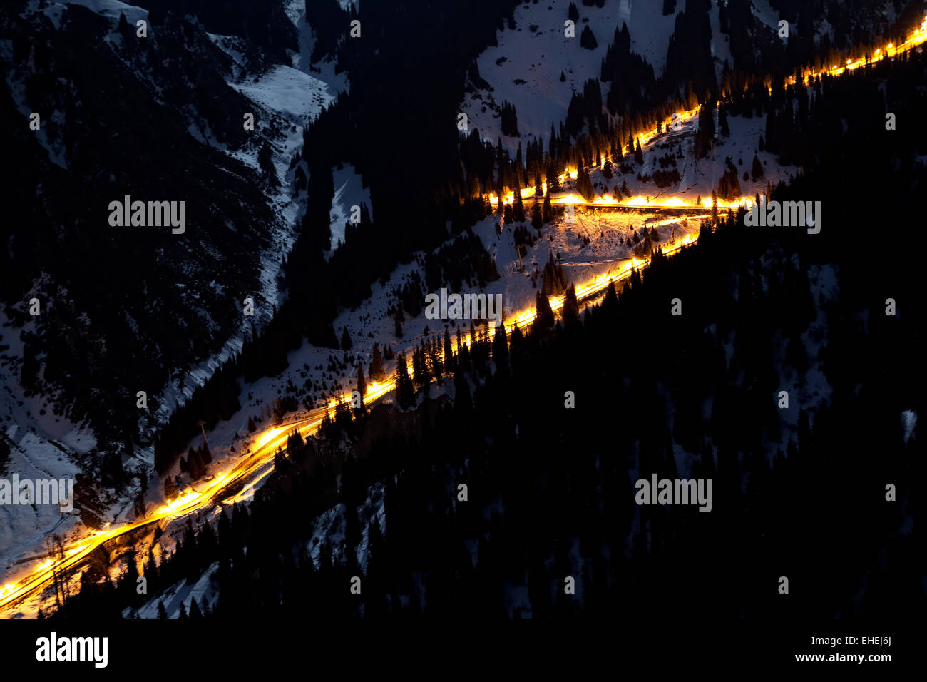 Night Road in winter mountains Stock Photo
