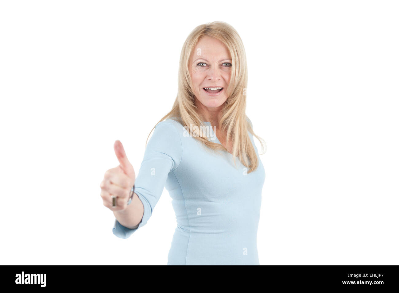 Middle aged woman with thumb up Stock Photo