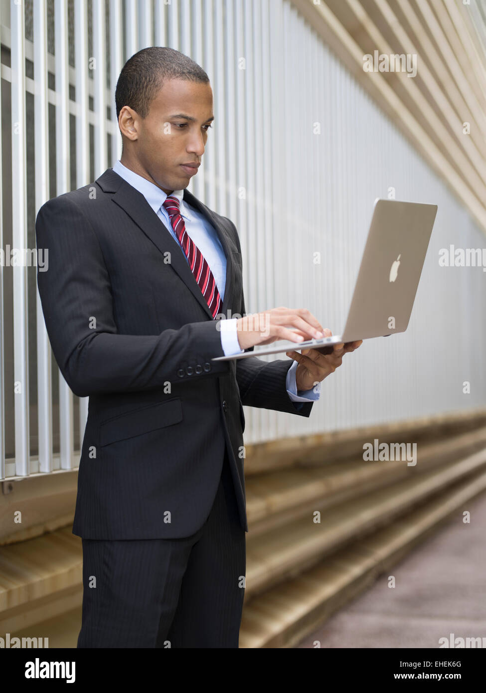 Working on location - with an Apple Macbook air Stock Photo