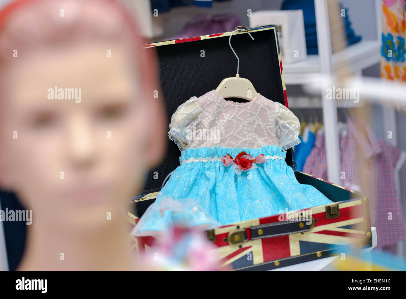 Baby blue dress hanging Stock Photo