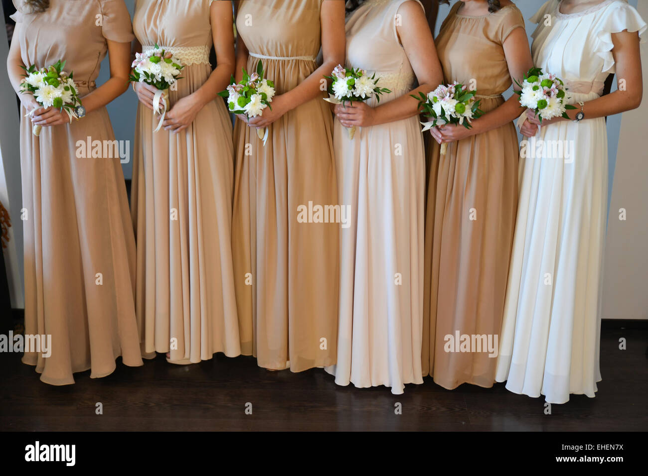 Bridesmaid holding in her hands a bouquet of flowers Stock Photo