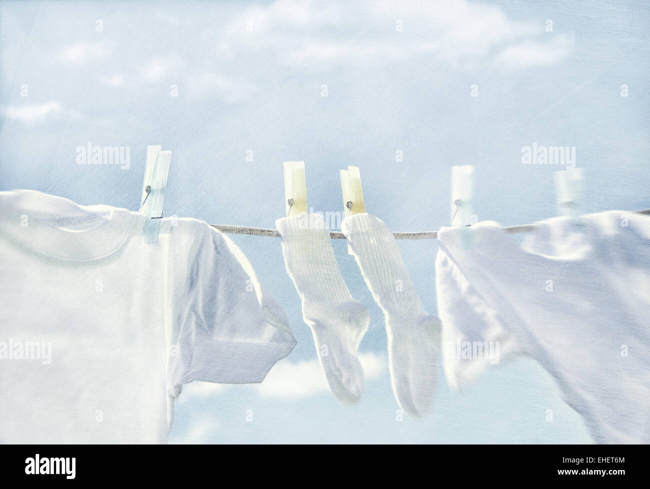 Clothes hanging on clothesline Stock Photo - Alamy