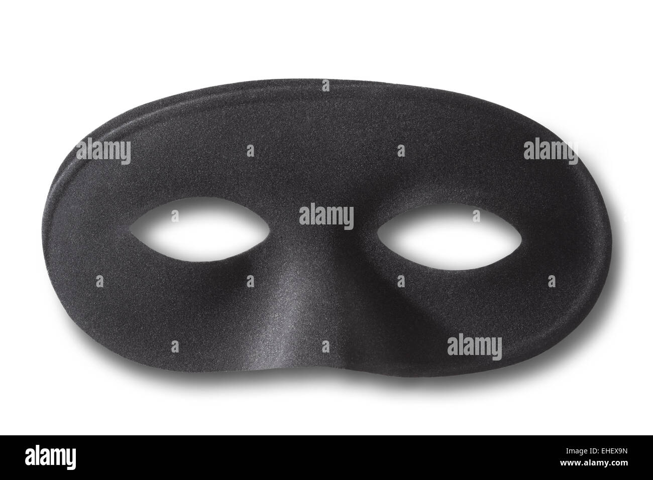 Carnival black mask with soft shadow on white Stock Photo