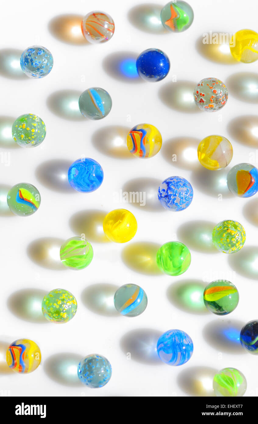 Colorful different Marbles on white background Stock Photo