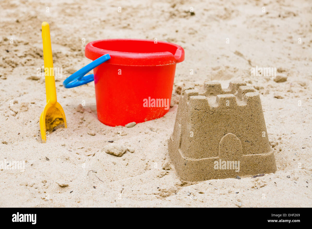 Sandcastle with bucket and shovel Stock Photo Alamy