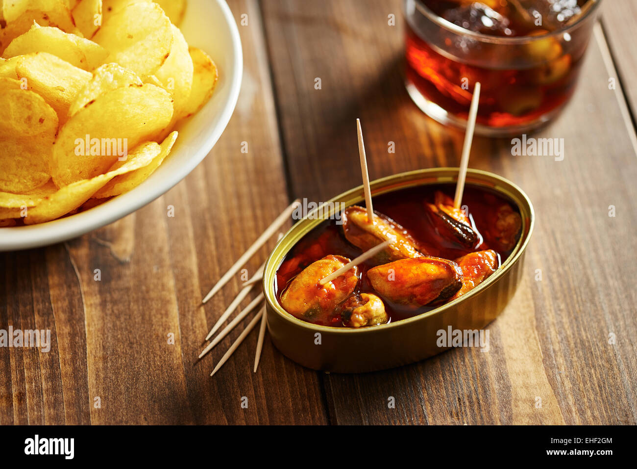 Mussels in vinegar with vermouth and other appetizers such as potato