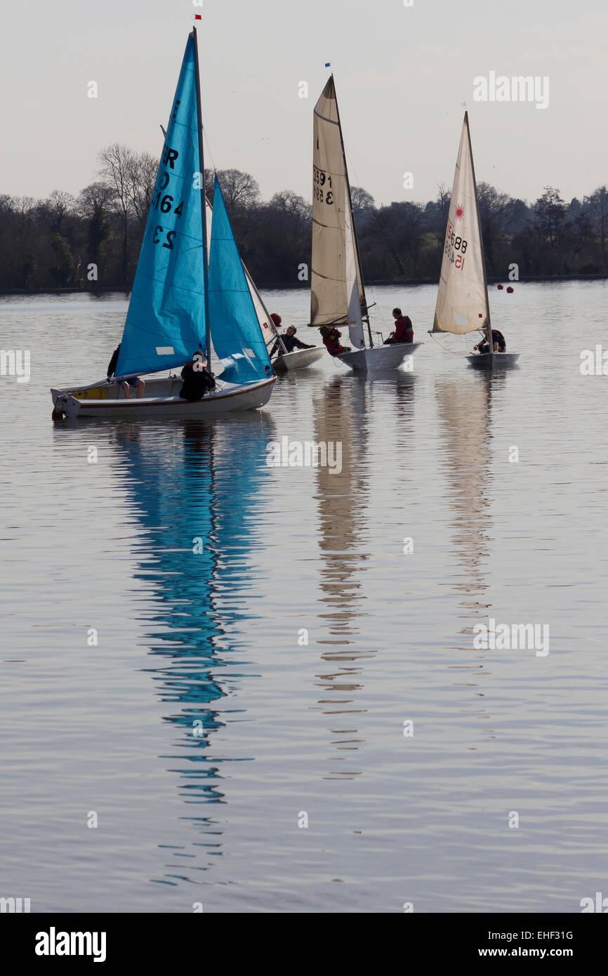 Dinghies sailing on a lake on a calm day Stock Photo