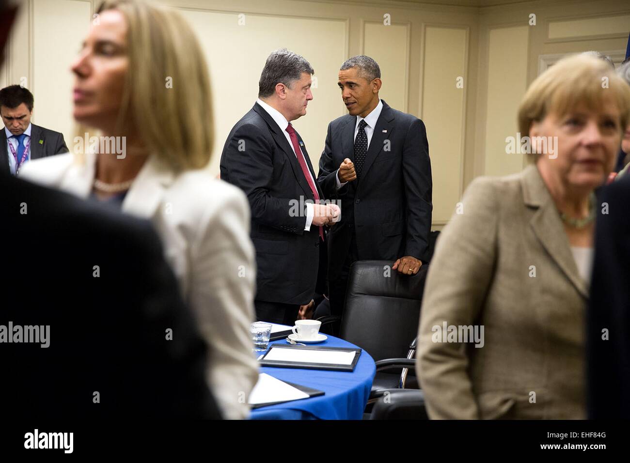 US President Barack Obama speaks with President Petro Poroshenko of Ukraine following a meeting with leaders from Italy, France, Germany and the United Kingdom at the Celtic Manor Resort September 4, 2014 in Newport, Wales. Stock Photo