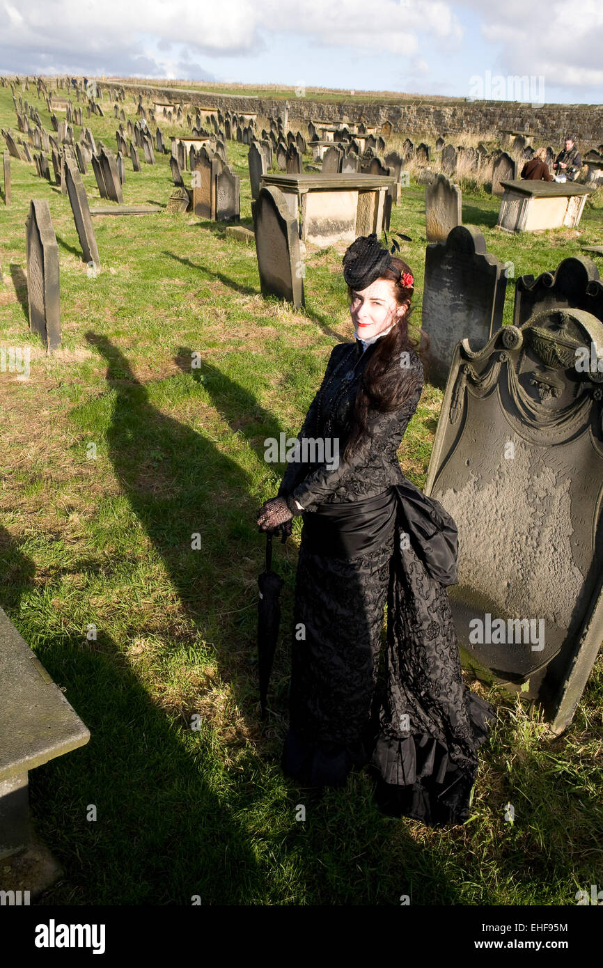 Lady in costume in graveyard at Whitby Goth Weekender. Stock Photo