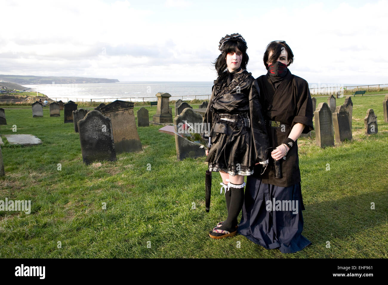 Young couple in Japanese style Gothic Lolita fashion aWhitby Goth Weekender. Stock Photo